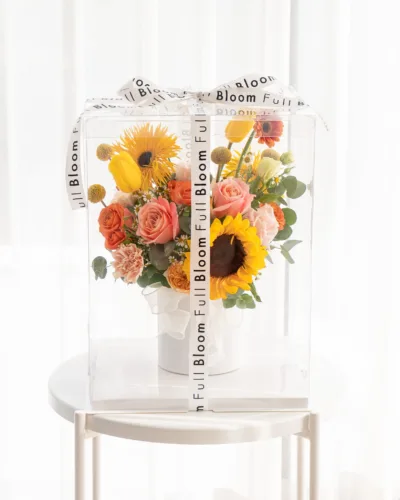 Peachy Sunrise - Flower Arrangement in Clear Box